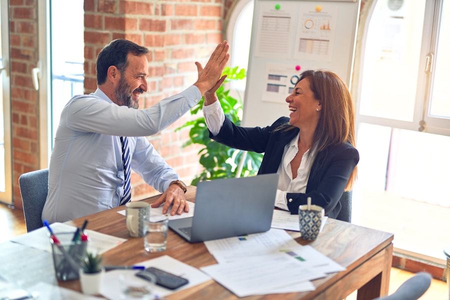 Business partners shaking hands after a successful review